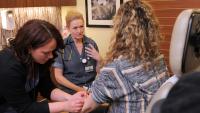 Lynn Simpson, MD, with patient